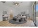 Spacious bedroom with backyard view and slider access, featuring wood floors at 437 Via Stretto Ave, Henderson, NV 89011