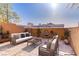 Comfortable patio featuring elegant furniture, water fountain, and lush greenery at 437 Via Stretto Ave, Henderson, NV 89011