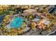 Stunning aerial view of a community pool area surrounded by palm trees and residences at 437 Via Stretto Ave, Henderson, NV 89011