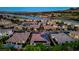 Stunning aerial view of luxury homes along a lake, showcasing the community's prime waterfront location at 47 Garibaldi Way, Henderson, NV 89011