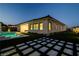 Exterior view of home highlighting the landscaped backyard, pool area, and stylish outdoor living space at 47 Garibaldi Way, Henderson, NV 89011