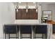 Stylish bar area with marble countertops and pendant lighting at 47 Garibaldi Way, Henderson, NV 89011