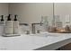 Bright bathroom featuring a white countertop, modern faucet, and decor at 47 Garibaldi Way, Henderson, NV 89011
