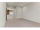 Bedroom featuring neutral carpet, a large window with a view, and white trim at 47 Garibaldi Way, Henderson, NV 89011