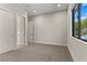 Empty bedroom with natural light, double door closet and door to additional living space at 47 Garibaldi Way, Henderson, NV 89011