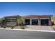 Charming single-story home with a well-maintained landscape and modern glass garage doors at 47 Garibaldi Way, Henderson, NV 89011