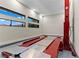 Bright garage space equipped with an automotive lift system and multiple windows at 47 Garibaldi Way, Henderson, NV 89011