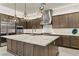Gourmet kitchen with marble countertops, stainless steel appliances, and stylish pendant lighting at 47 Garibaldi Way, Henderson, NV 89011