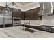 Gourmet kitchen features stainless steel appliances, custom cabinets, stylish backsplash, and marble countertops at 47 Garibaldi Way, Henderson, NV 89011