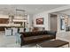 Open-concept living room with a modern kitchen and dining area at 47 Garibaldi Way, Henderson, NV 89011