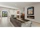 Spacious living room with modern design, fireplace, and adjacent bar area at 47 Garibaldi Way, Henderson, NV 89011