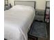 Bright bedroom with a comfortable bed and neutral decor at 4704 Obannon Dr # D, Las Vegas, NV 89102