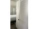 Cozy bedroom features a comfortable bed with a white comforter and closet with louvered doors at 4704 Obannon Dr # D, Las Vegas, NV 89102