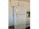 Kitchen featuring a white refrigerator with white cabinets and drawers at 4704 Obannon Dr # D, Las Vegas, NV 89102