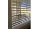 Window with blinds with a view of a landscaped area at 4704 Obannon Dr # D, Las Vegas, NV 89102