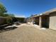 Backyard featuring a tan block wall, a small tree, a patio and a table with four chairs and an outdoor room at 511 Credence Ave, Henderson, NV 89002