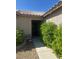 A covered entryway featuring a security screen door and desert landscaping on either side of the walkway at 511 Credence Ave, Henderson, NV 89002