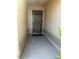 Close-up view of the front door, security screen door, and door mat that reads 'Home Sweet Welcome' at 511 Credence Ave, Henderson, NV 89002