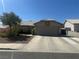 Traditional style house with a driveway leading to an attached garage and desert landscaping in front yard at 511 Credence Ave, Henderson, NV 89002