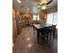 A well-lit kitchen with wood cabinets, stainless steel appliances, and a dining table with 4 chairs at 511 Credence Ave, Henderson, NV 89002