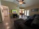 Open living room featuring hardwood floors, a fireplace, and a view into the dining room at 511 Credence Ave, Henderson, NV 89002