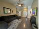Open living room featuring a large sectional couch and a view to the front door at 511 Credence Ave, Henderson, NV 89002