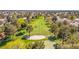 Beautiful aerial view of lush golf course surrounded by homes, sand traps, and mature trees at 5157 Future Dr, Las Vegas, NV 89130