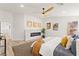 Spacious bedroom with a fireplace, ceiling fan, and two large windows at 5157 Future Dr, Las Vegas, NV 89130