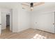 This bedroom offers wood laminate flooring, a ceiling fan, and a large closet at 5157 Future Dr, Las Vegas, NV 89130