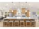 Bright kitchen with modern light fixtures, stainless appliances, and a large marble island with seating at 5157 Future Dr, Las Vegas, NV 89130