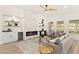 Cozy living area with decorative fireplace, wet bar, open shelving, comfortable seating and natural light at 5157 Future Dr, Las Vegas, NV 89130