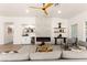Open living room with a modern fireplace, bar, and comfortable seating at 5157 Future Dr, Las Vegas, NV 89130