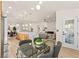 Spacious open-concept living space with modern fireplace, kitchen island and dining area at 5157 Future Dr, Las Vegas, NV 89130