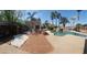 A tranquil backyard showcasing a pool with a waterfall, gazebo, and a fire pit at 5312 Manuel Dr, Las Vegas, NV 89149