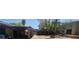 A large backyard features an outdoor living area with pool and shaded seating at 5312 Manuel Dr, Las Vegas, NV 89149