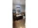 Modern bathroom featuring a vanity with a black countertop, lighted mirror, and tiled floor at 5312 Manuel Dr, Las Vegas, NV 89149