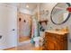 Charming bathroom with a walk-in shower, wooden vanity, and decorative accents at 5312 Manuel Dr, Las Vegas, NV 89149