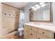 Bathroom boasts a tiled shower, stylish vanity, and a large mirror at 5312 Manuel Dr, Las Vegas, NV 89149