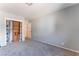 Bedroom with neutral carpet, custom shelving and an open doorway at 5312 Manuel Dr, Las Vegas, NV 89149