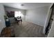 Carpeted bedroom featuring a large window with natural light at 5312 Manuel Dr, Las Vegas, NV 89149