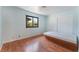 Bedroom features hardwood floors, sliding door closet, and exterior view at 5312 Manuel Dr, Las Vegas, NV 89149