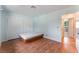 Bedroom features hardwood floors, sliding door closet and an open doorway at 5312 Manuel Dr, Las Vegas, NV 89149
