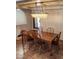 Charming dining room with a large table, ample seating, and modern chandelier at 5312 Manuel Dr, Las Vegas, NV 89149