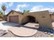 Charming home featuring a unique architectural design, desert landscaping, and an attached two-car garage at 5312 Manuel Dr, Las Vegas, NV 89149