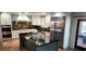 Spacious kitchen with stainless steel appliances, a large island, and custom cabinets at 5312 Manuel Dr, Las Vegas, NV 89149
