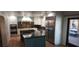 Kitchen with stainless steel appliances, central island and backyard access at 5312 Manuel Dr, Las Vegas, NV 89149