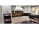 Gourmet kitchen featuring custom cabinetry, granite countertops, and stainless steel appliances at 5312 Manuel Dr, Las Vegas, NV 89149