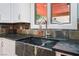 Kitchen with custom cabinets, stainless steel appliances, and stone backsplash at 5312 Manuel Dr, Las Vegas, NV 89149