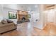 Cozy living room with a fireplace, neutral color scheme, and natural light streaming through the windows at 5312 Manuel Dr, Las Vegas, NV 89149
