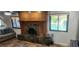 Cozy living room with fireplace and view to outdoor pool at 5312 Manuel Dr, Las Vegas, NV 89149
